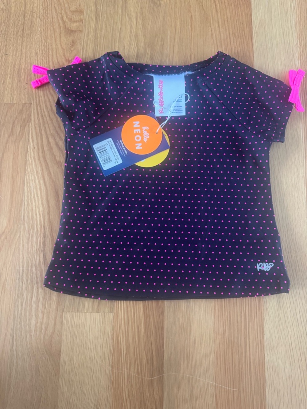 NWT. RuffleButts Black Tee with Neon Pink Polka Dots